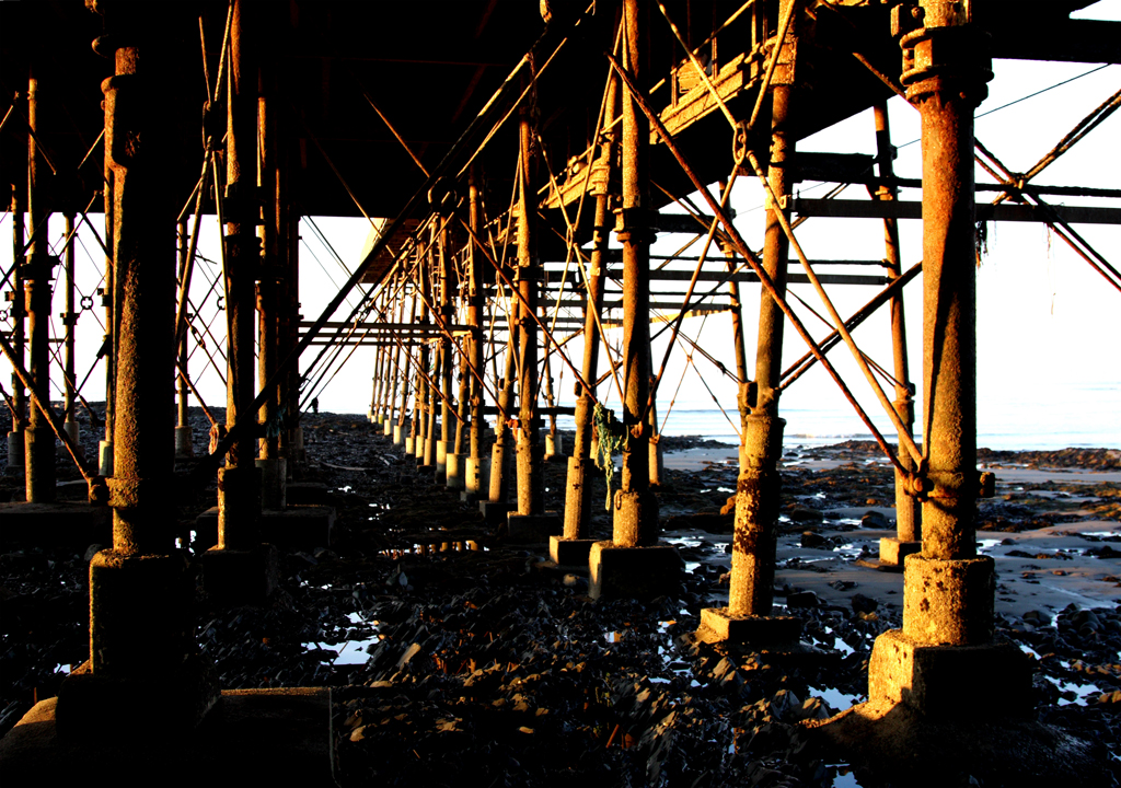 Beneath Aberystwyth Pier, near sunset